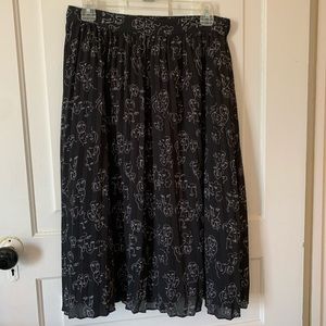 Abstract Faces Black Skirt